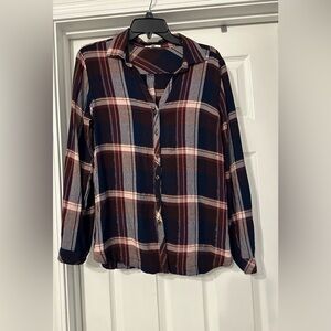 Maurices plaid button side blouse is a size medium.